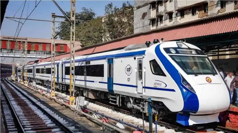 Vande-Bharat-Train-at-a-station-in-mumbai-min-1